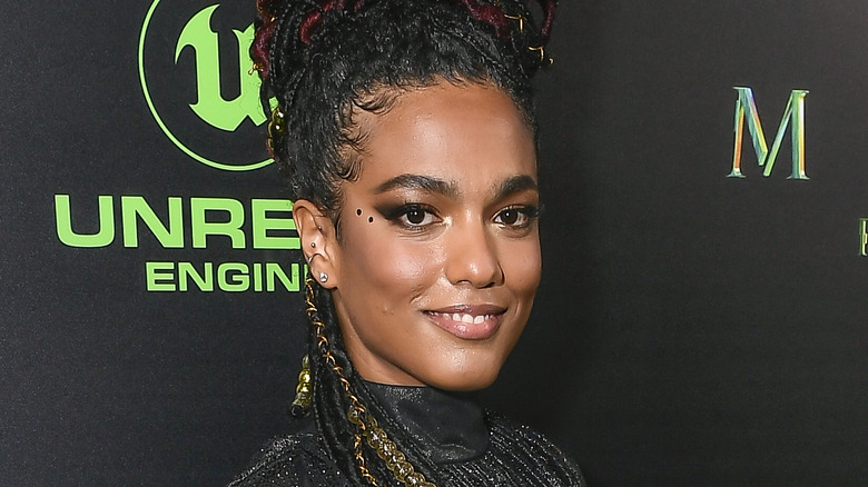 Freema Agyeman smiling at the Matrix: Resurrections premiere