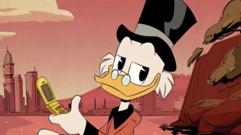 Scrooge holding phone and smiling DuckTales