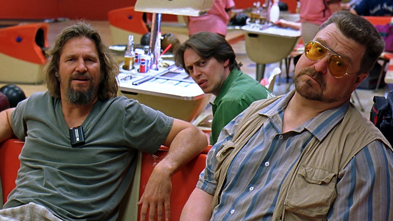 The Dude, Donny, and Walter sitting in the bowling alley