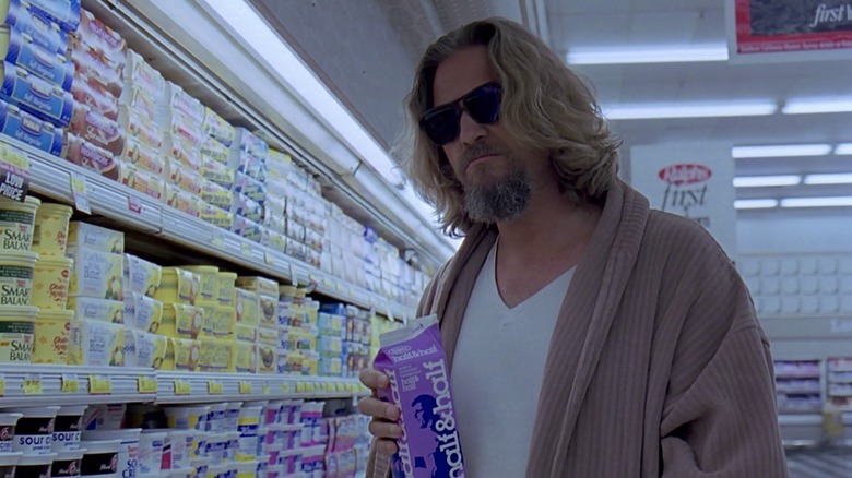 The Dude shopping for cream in a cardigan and shades