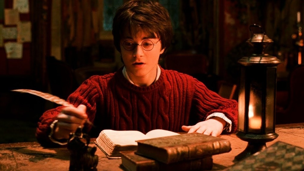 Daniel Radcliffe Harry Potter writing quill red sweater