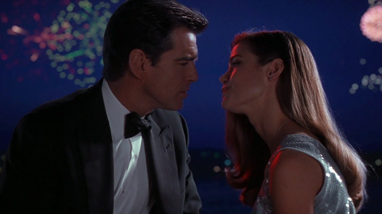 James Bond (Pierce Brosnan) and Dr. Christmas Jones (Denise Richards) in front of some fireworks in "The World is Not Enough"