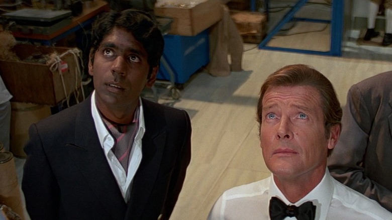 Vijay (Vijay Amritaj) and James Bond (Roger Moore) in Q Branch in "Octopussy"