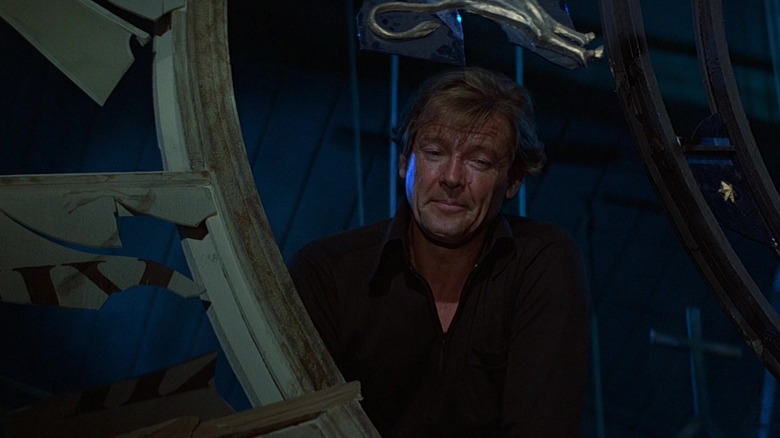 James Bond (Roger Moore) looks down from a clocktower at his kill in "Moonraker"