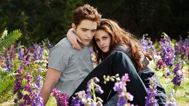 Edward, Bella in field wearing engagement ring