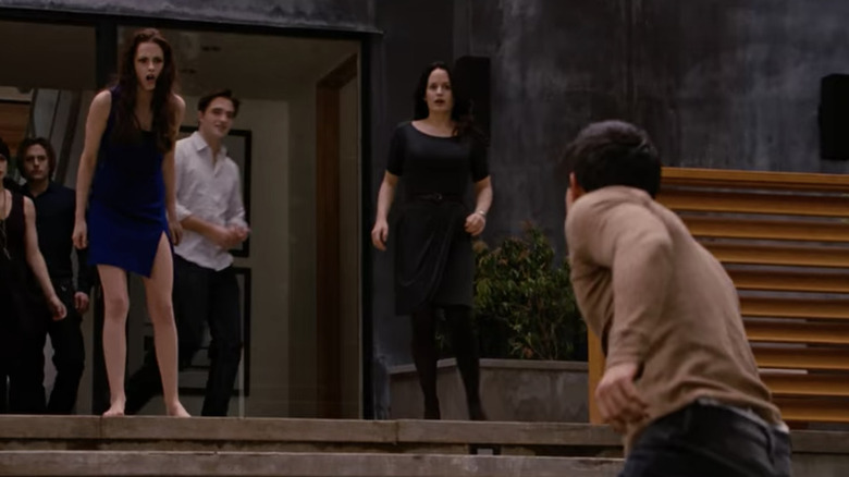 Bella faces off with Jacob while Cullens watch