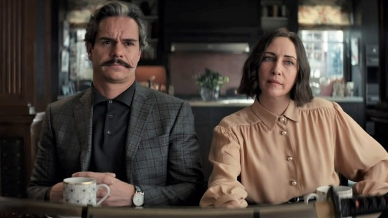 Eleanor Bishop and Jack Duquesne sitting at a table