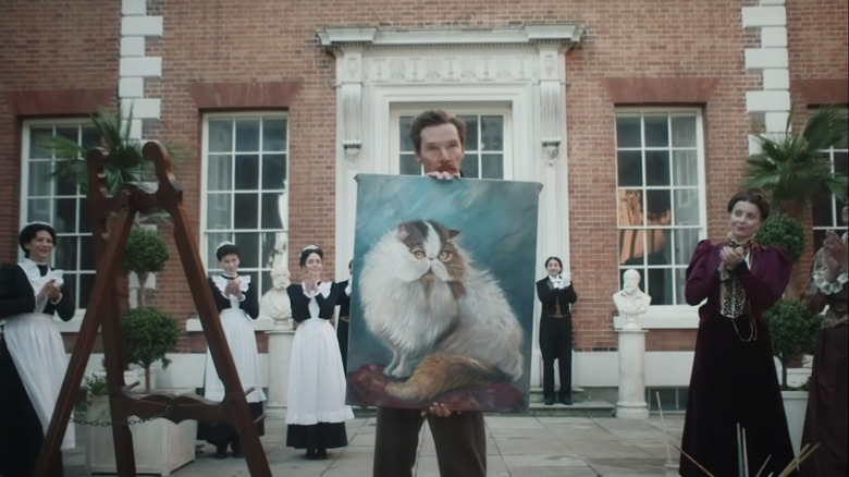 Benedict Cumberbatch holding cat painting