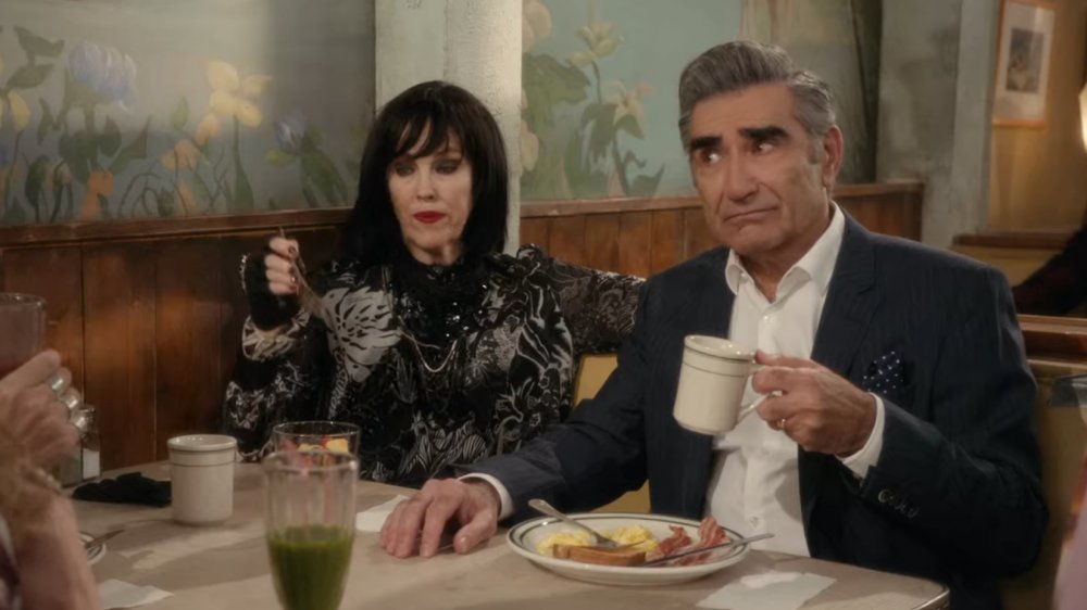 Catherine O'Hara and Eugene Levy as Moira and Johnny Rose having breakfast at the local diner on Schitt's Creek