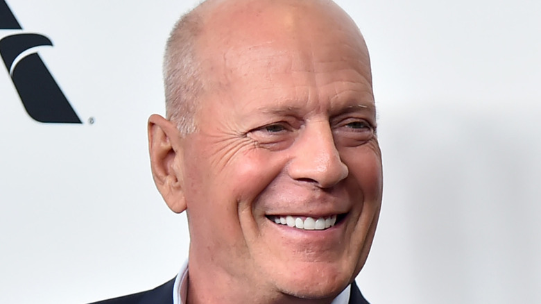 Bruce Willis posing for a photo