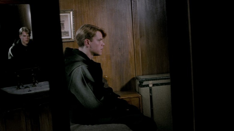 Tom Ripley sitting in his ship bedroom