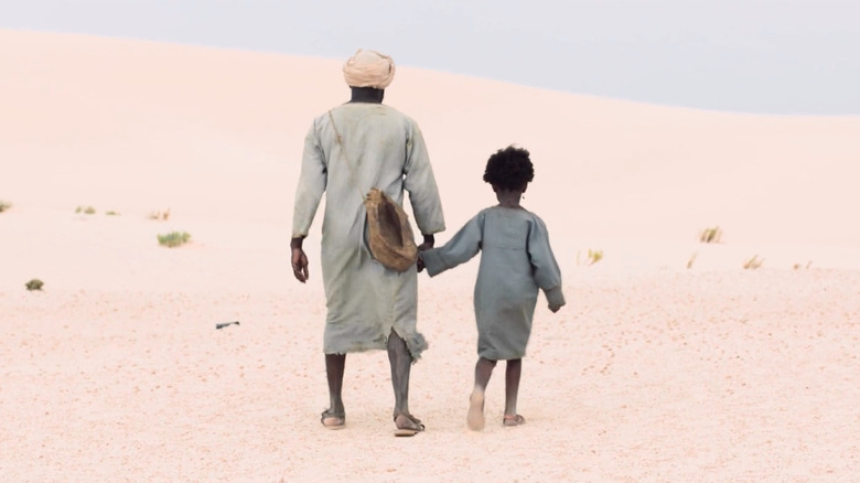 Berber walks with his daughter