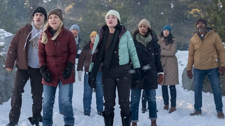 Teens and parents in snow