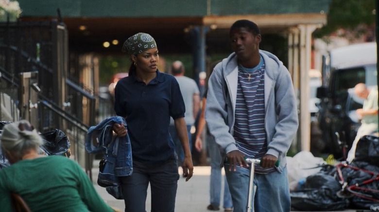 Inez and Terry walk together along the street