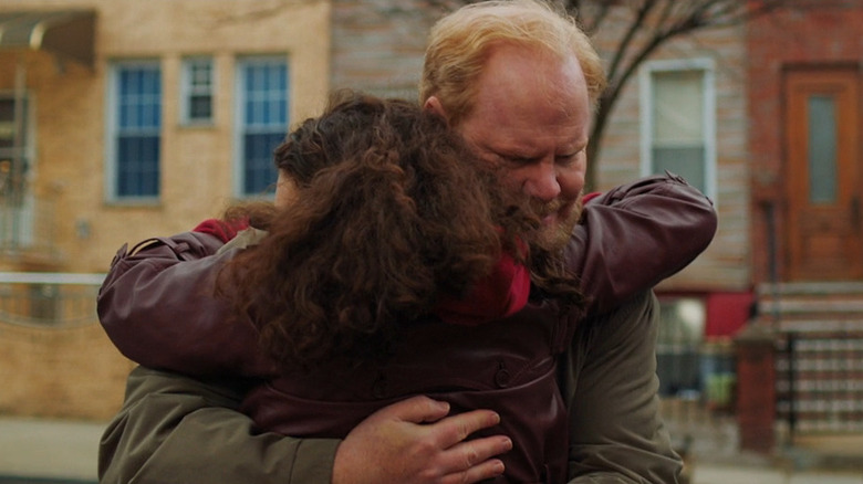 Holly hugging her father