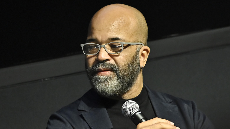 Jeffrey Wright holding a microphone