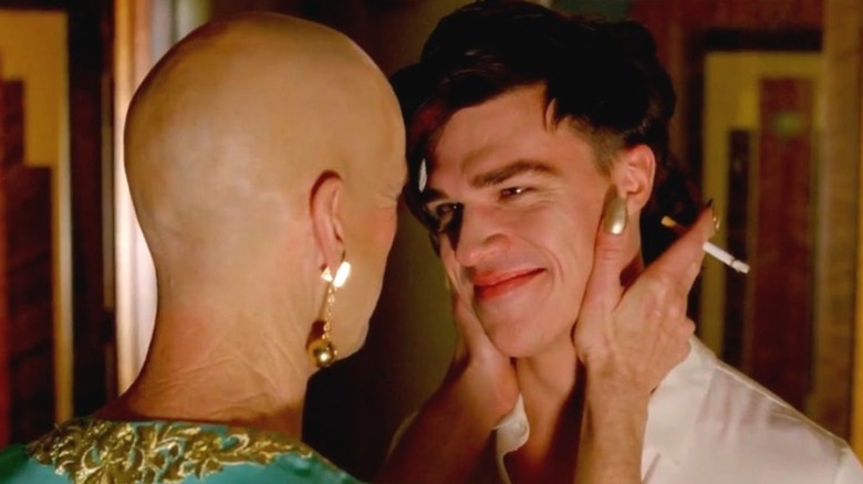 Back of Denis O'hare head, Finn Wittrock smiling face