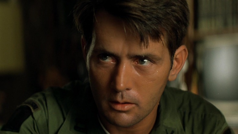 Martin Sheen staring in green army jacket