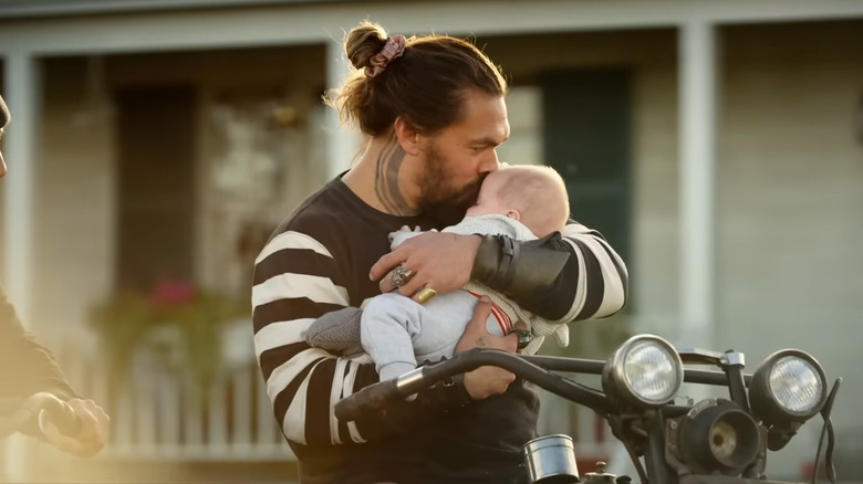 Arthur Curry kisses baby