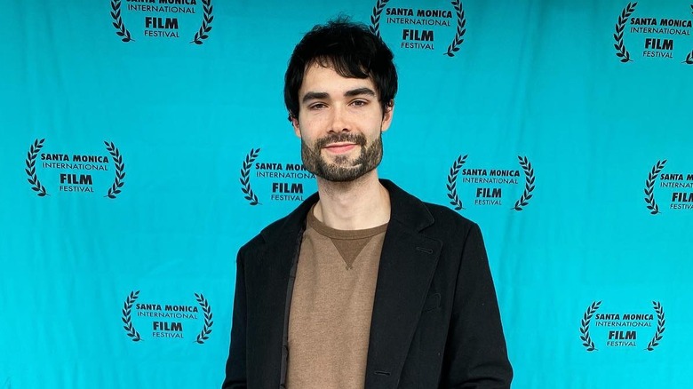 Rankin Dean smiling in black jacket