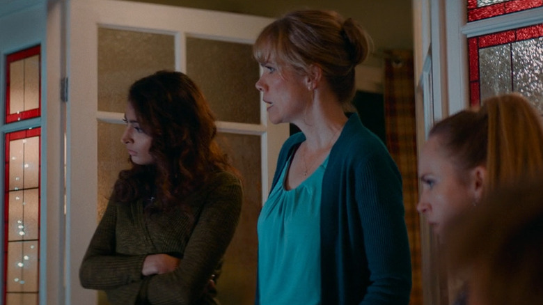 Women watching TV in Await Further Instructions 