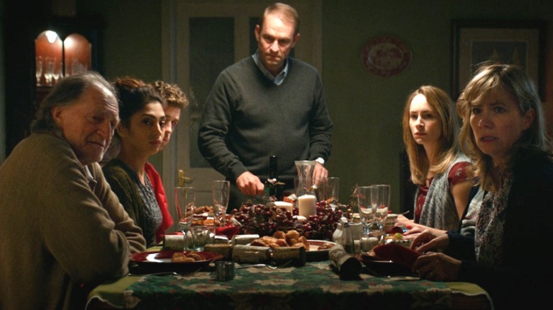 Tony cutting turkey in Await Further Instructions 