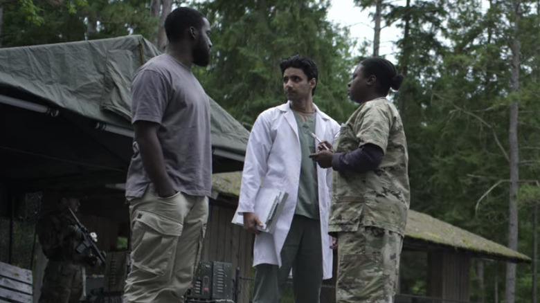 Soldier holds syringe for Dodge Netflix Awake 2021 movie