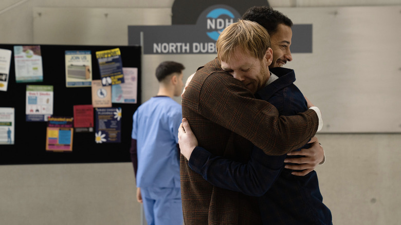 Thomas and Matt Claffin hug in the hospital