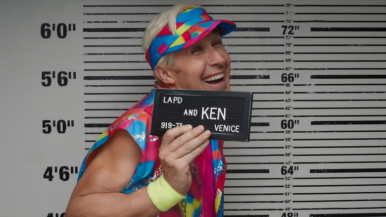 Ken smiles in mugshot photo