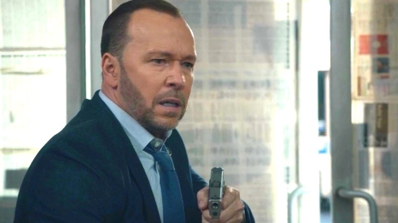 Donnie Wahlberg holding a gun