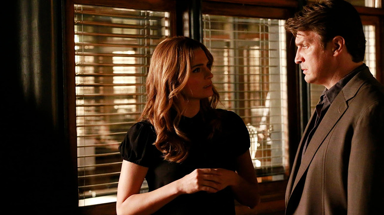 Castle and Beckett talk in office next to window