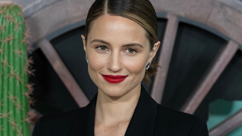 Dianna Agron smiling, wearing red lipstick