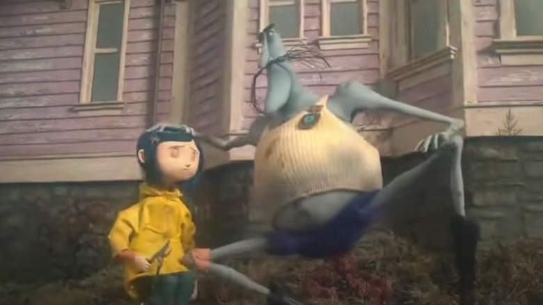 Bobinsky crouches next to Coraline