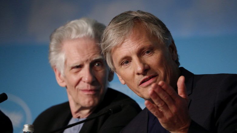 Viggo Mortensen gestures next to David Cronenberg