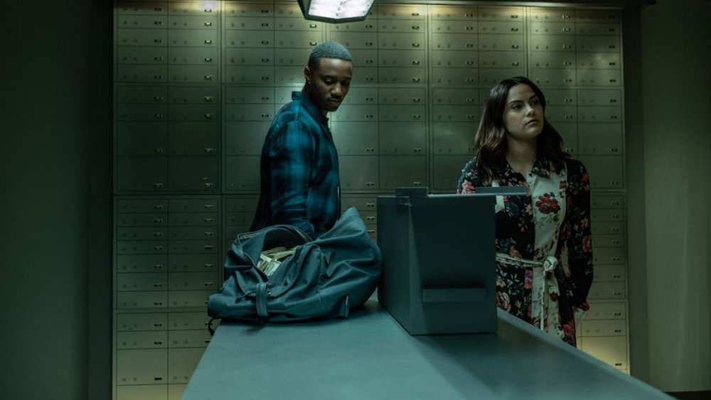 Camila Mendes as Katie and Jessie T. Usher as Adam at the safe deposit box in Dangerous Lies