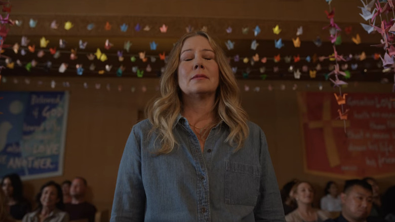 Christina Applegate surrounded by origami cranes in "Dead to Me"