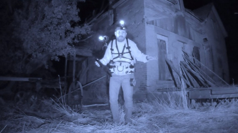 Joseph Winter standing in front of a house