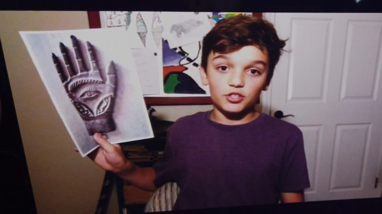 Hayden Gariety holding a photograph