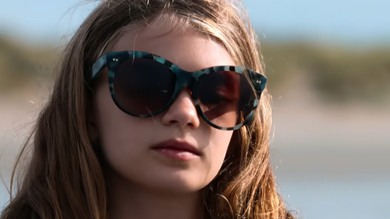 Hannah at the beach in sunglasses