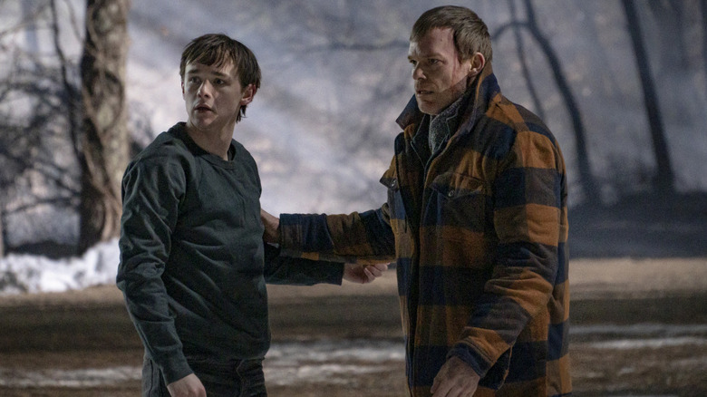 Dexter (Michael C. Hall) looks to comfort Harrison (Jack Alcott), who looks confused in "Dexter: New Blood"