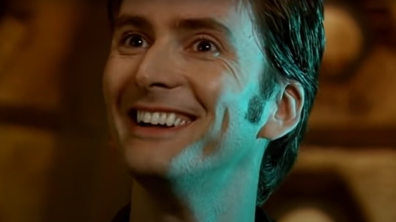 Tenth Doctor grinning at Rose