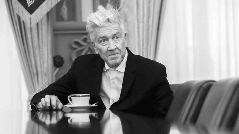 David Lynch sitting at a table