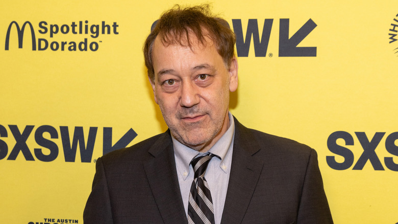 Sam Raimi in a dark suit