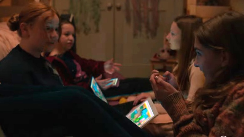 Bouchard girls sitting with computers and phones