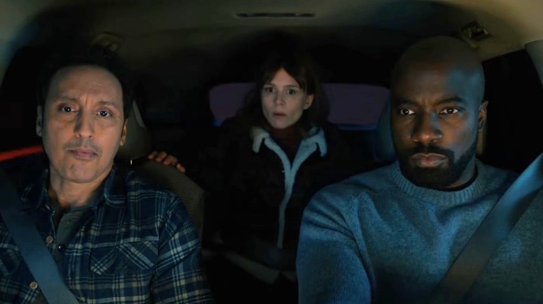 Ben, David, and Kristen driving in car at night 