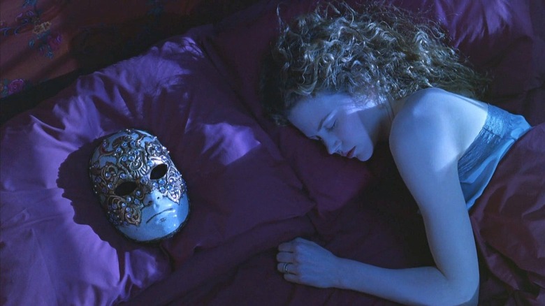 Alice sleeping with a mask on pillow next to her