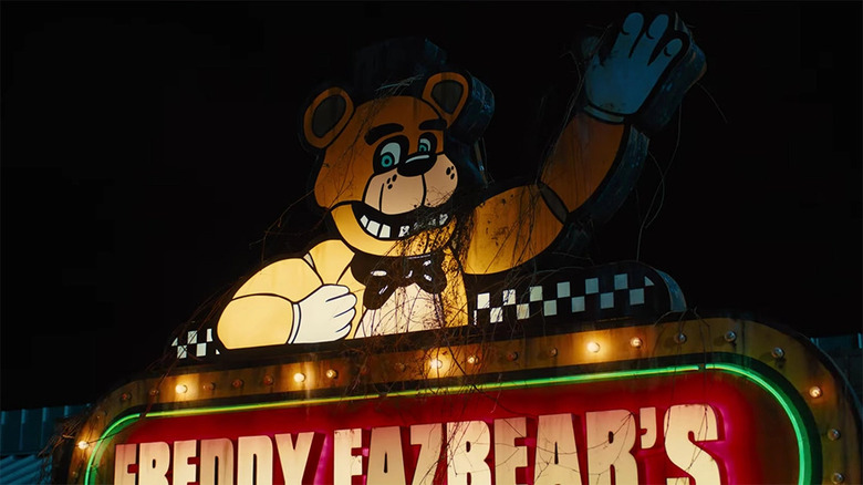 Freddy Fazbear's Pizza sign illuminated