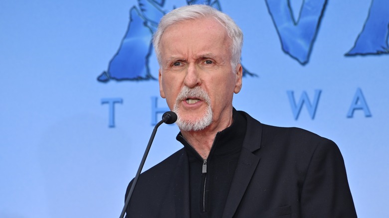 James Cameron speaking into microphone