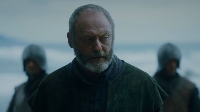 Davos Seaworth flanked by guards