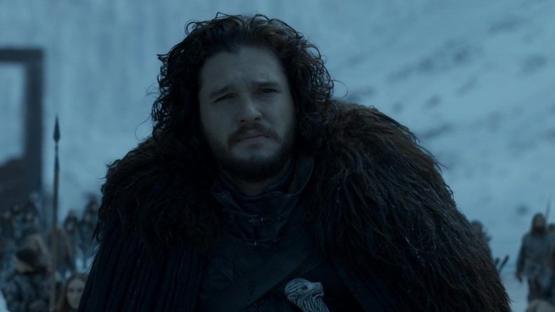 Jon Snow wearing black cloak